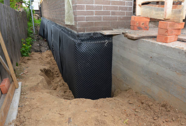 Happy homeowners after waterproofing job in Genesee Depot